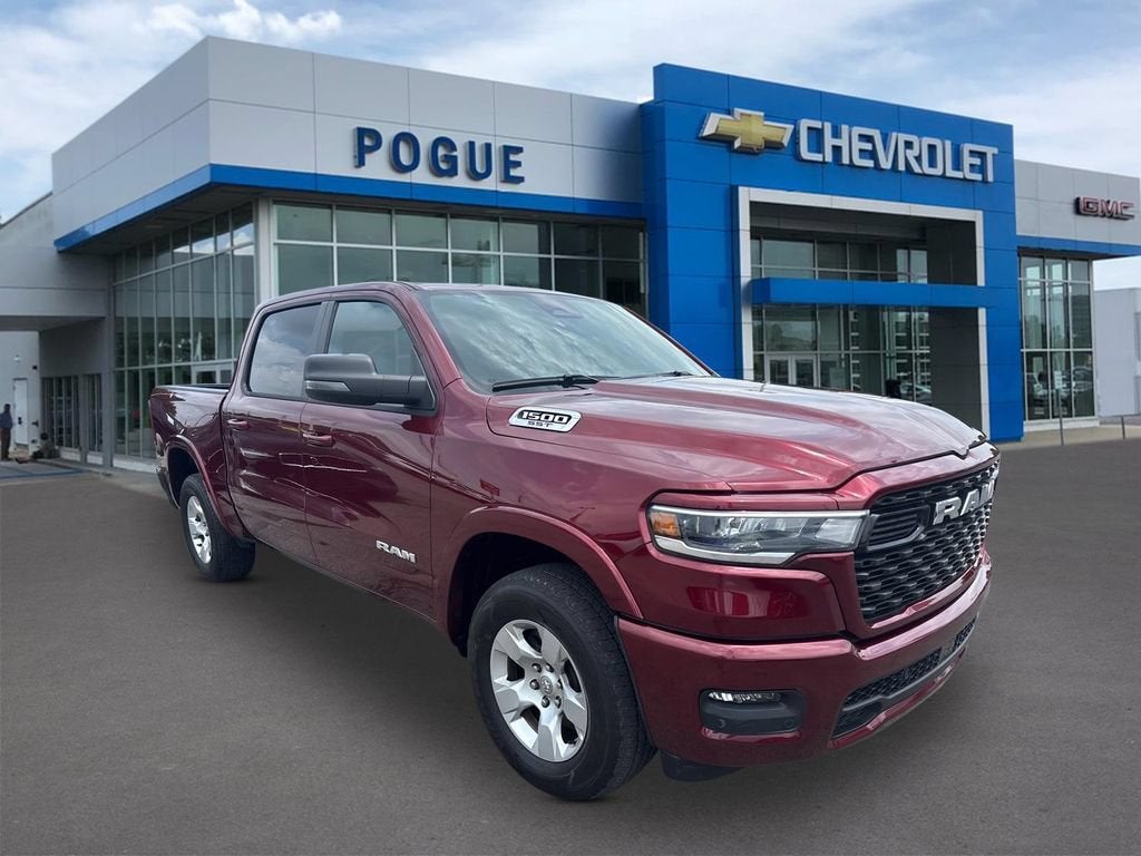 2025 RAM 1500 Big Horn in Burgundy — front three-quarter view